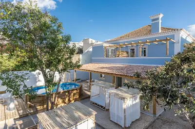 an aerial view of a house with a swimming pool at Amália Boutique Suites & Studios - by @ rita´s place in Faro