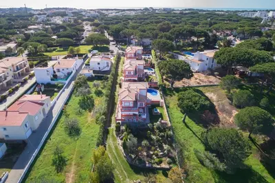 an aerial view of a residential neighborhood with houses at 7+1 BEDROOM PRIVATE VILLA, HEATED POOL, GAMES, BBQ in Albufeira