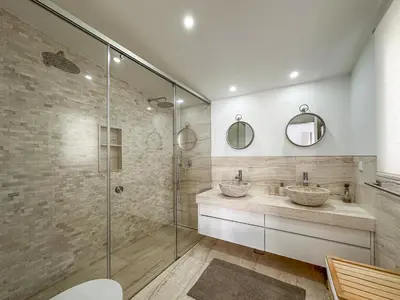 a bathroom with two sinks and a shower at Luxury Villa Heated Pool, walk to São Rafael Beach, Albufeira in Albufeira