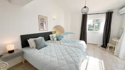 a bedroom with a bed and a window at Villa Bea by Sunny Deluxe in Albufeira