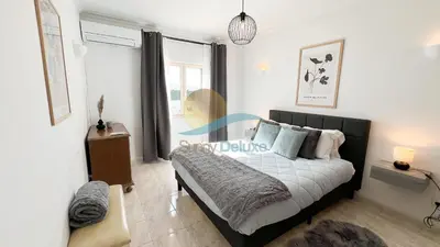a bedroom with a bed and a window at Villa Bea by Sunny Deluxe in Albufeira