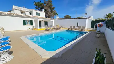 a swimming pool in front of a house at Villa Bea by Sunny Deluxe in Albufeira