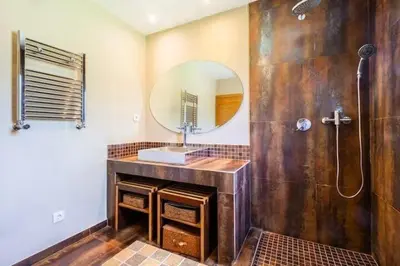 a bathroom with a sink and a mirror at Villa Palm Retreat - Beautiful idyllic views in Boliqueime