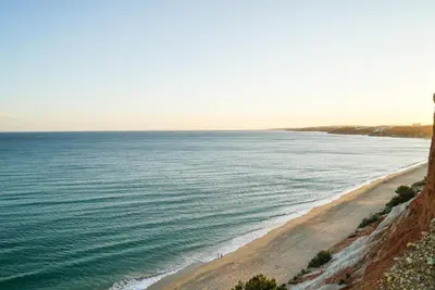 a view of the beach from a cliff at Falésia Cliff Apartment by The Portuguese Butler in Albufeira