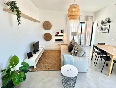a living room with a couch and a table at Casa Diogo in Faro