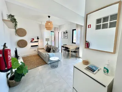 a living room with a couch and a table at Casa Diogo in Faro