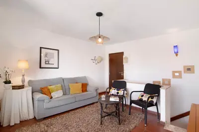 a living room with a couch and two chairs at Apartment Montechoro in Albufeira