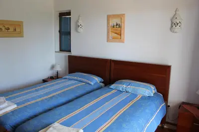 two beds sitting next to each other in a bedroom at ABF18V3 Moradia qualidade e piscina,lindas v in Albufeira