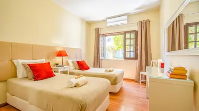 a large living room with a brick wall at Villa Royal Sandals by Algarve Vacation in Albufeira