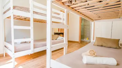 a bedroom with two beds and a red lamp at Villa Royal Sandals by Algarve Vacation in Albufeira
