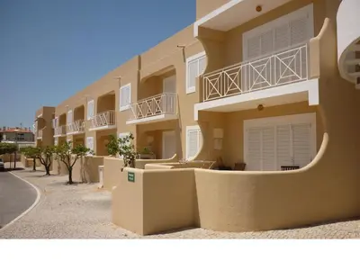 a building with balconies on the side of a street at Apartamentos Mar-Sol Villas in Vilamoura