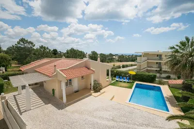 a villa with a swimming pool and a house at ABF36V2 Charming 2 bdr villa located only a few mi in Albufeira