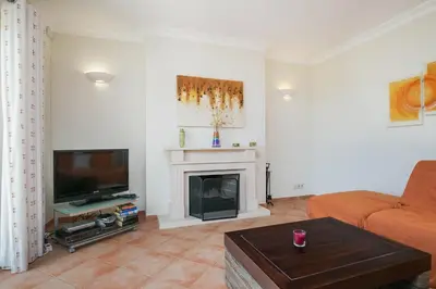 a living room with a television and a fireplace at ABF36V2 Charming 2 bdr villa located only a few mi in Albufeira