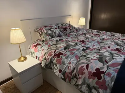 a living room with a couch and a flat screen tv at Ocean View Getaway in Albufeira