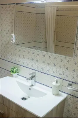a bathroom with a sink and a mirror at Green 104 in Albufeira