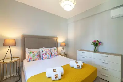 a bedroom with a bed with two towels on it at Vilamoura - MAGNÓLIA 512 - T1 in Vilamoura