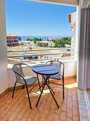 a table and two chairs on a balcony at Apart 2 VelaMar - BY BEDZY in Albufeira
