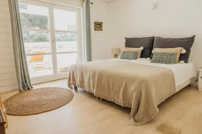 a bedroom with a bed and a window at Casalot Almancil in Almancil