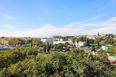 an empty street in front of a building at T2 Tubio in Albufeira