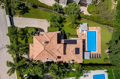 an aerial view of a house with a swimming pool at Villa Simone in Almancil