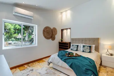 a bedroom with a bed and a window at Villa Sea, Sun and Golf in Vilamoura in Quarteira