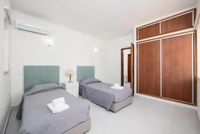 a bathroom with a shower and a toilet and a sink at Villa Veiguinha in Galé