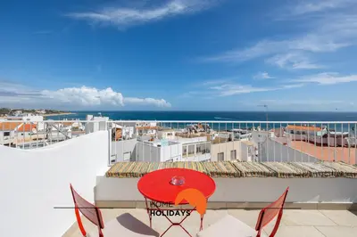 a view of the ocean from the roof of a building at #195 Rossio Mar by Home Holidays in Albufeira