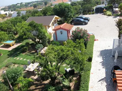 a small house with a car parked in a driveway at CH 7 - One Bedroom Apartment, Casa da Horta, Pool and Garden in Albufeira