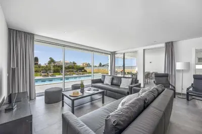 a large living room with a couch and a table at Villa Casa Magnolia by Villa Plus in Galé