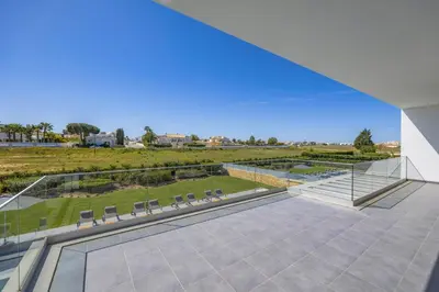 a patio with chairs and a view of a park at Villa Casa Magnolia by Villa Plus in Galé