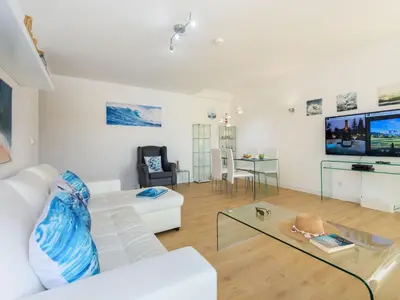 a bedroom with two beds and surfboards on the wall at Apartment The LightHouse by Interhome in Albufeira