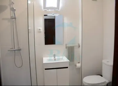 a bathroom with a shower and a sink and a toilet at Blife Julya private rooms in Faro