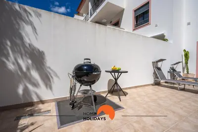 a bbq grill in a room with a wall at #194 Dream Flat by Home Holidays in Albufeira