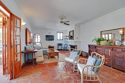a living room with a couch and a table at Quinta Grande de Boliqueime by Portucasa in Boliqueime