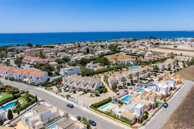 an aerial view of a resort and the ocean at Villa Algarhb by Villa Plus in Albufeira
