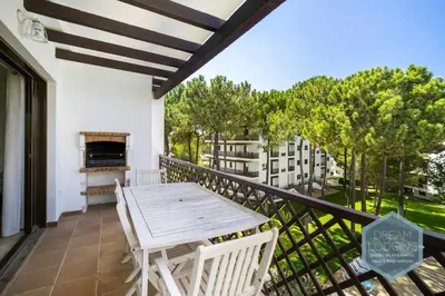 a table and chairs on a balcony with a fireplace at Rooftop 27 - Dream Lodging in Albufeira