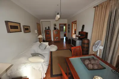 a living room with a couch and a table at Vila Bairos Apartment Vilamoura in Vilamoura