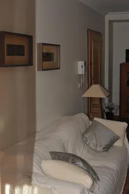 a white bed with a pillow on top of it at Vila Bairos Apartment Vilamoura in Vilamoura