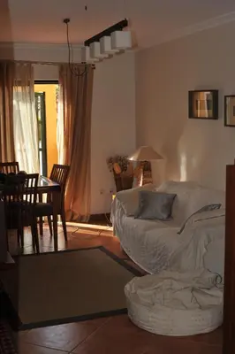 a living room with a couch and a table at Vila Bairos Apartment Vilamoura in Vilamoura