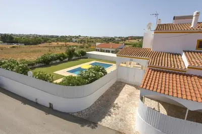 an aerial view of a house with a swimming pool at Villa Carlos by Villa Plus in Galé