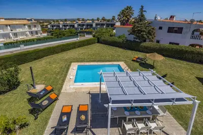 an overhead view of a backyard with a swimming pool at Villa Casa Duarte by Villa Plus in Olhos de Água
