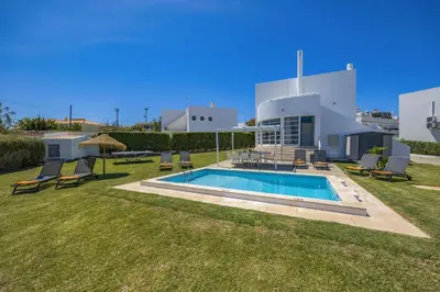 a house with a swimming pool in the yard at Villa Casa Duarte by Villa Plus in Olhos de Água