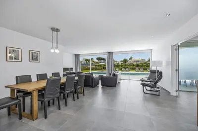 a dining room with a table and chairs at Villa Casa Gardenia by Villa Plus in Galé