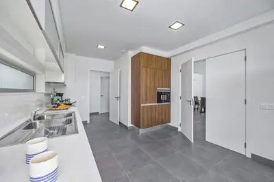 a kitchen with a sink and a counter top at Villa Casa Gardenia by Villa Plus in Galé