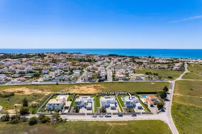 an aerial view of a villa with the ocean in the background at Villa Casa Gardenia by Villa Plus in Galé