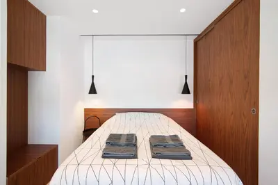 a bedroom with a bed with two towels on it at Casa Alameda in Faro