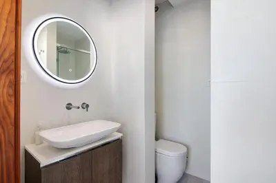 a bathroom with a sink and a mirror at Casa Alameda in Faro