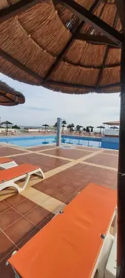 a view of a swimming pool from the roof of a resort at White Studio - Ocean View in Albufeira