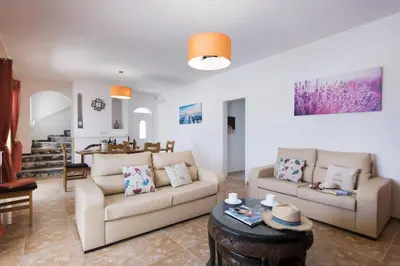 a living room with two couches and a table at Villa Luis Gale by Villa Plus in Galé