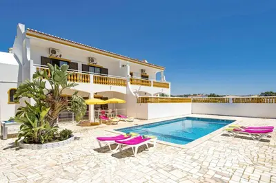 a villa with a swimming pool and a house at Villa Luis Gale by Villa Plus in Galé